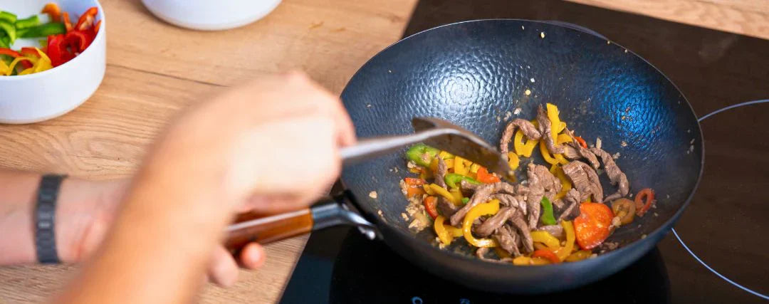 Wok op inductie: alles wat je moet weten voor je koopt