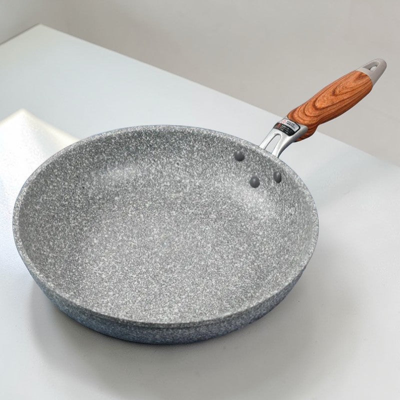Le Yukano keramische wokpan inductie op inductiekookplaat in gebruik
