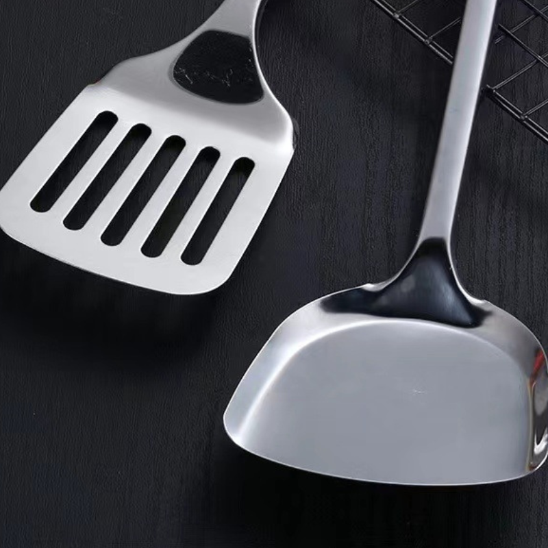 Le Yamiro wok gereedschap set schuimspaan detailopname rvs gaatjes