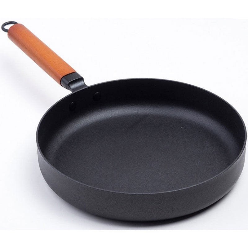 Le Pokaj koolstofstalen wokpan 26 cm vooraanzicht neutrale achtergrond