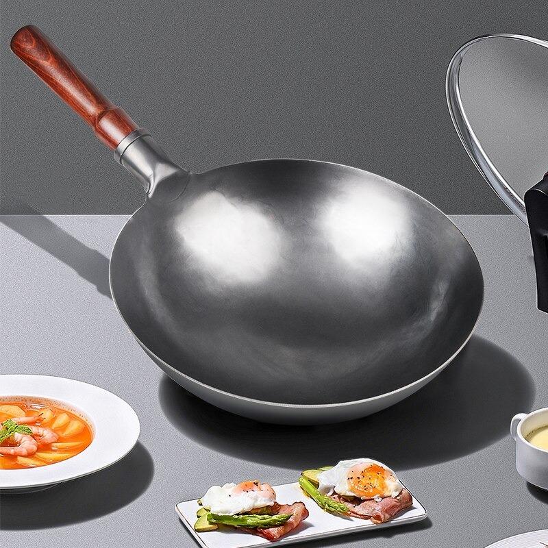 Le Nasu smeedijzeren wok verpakking en meegeleverde accessoires